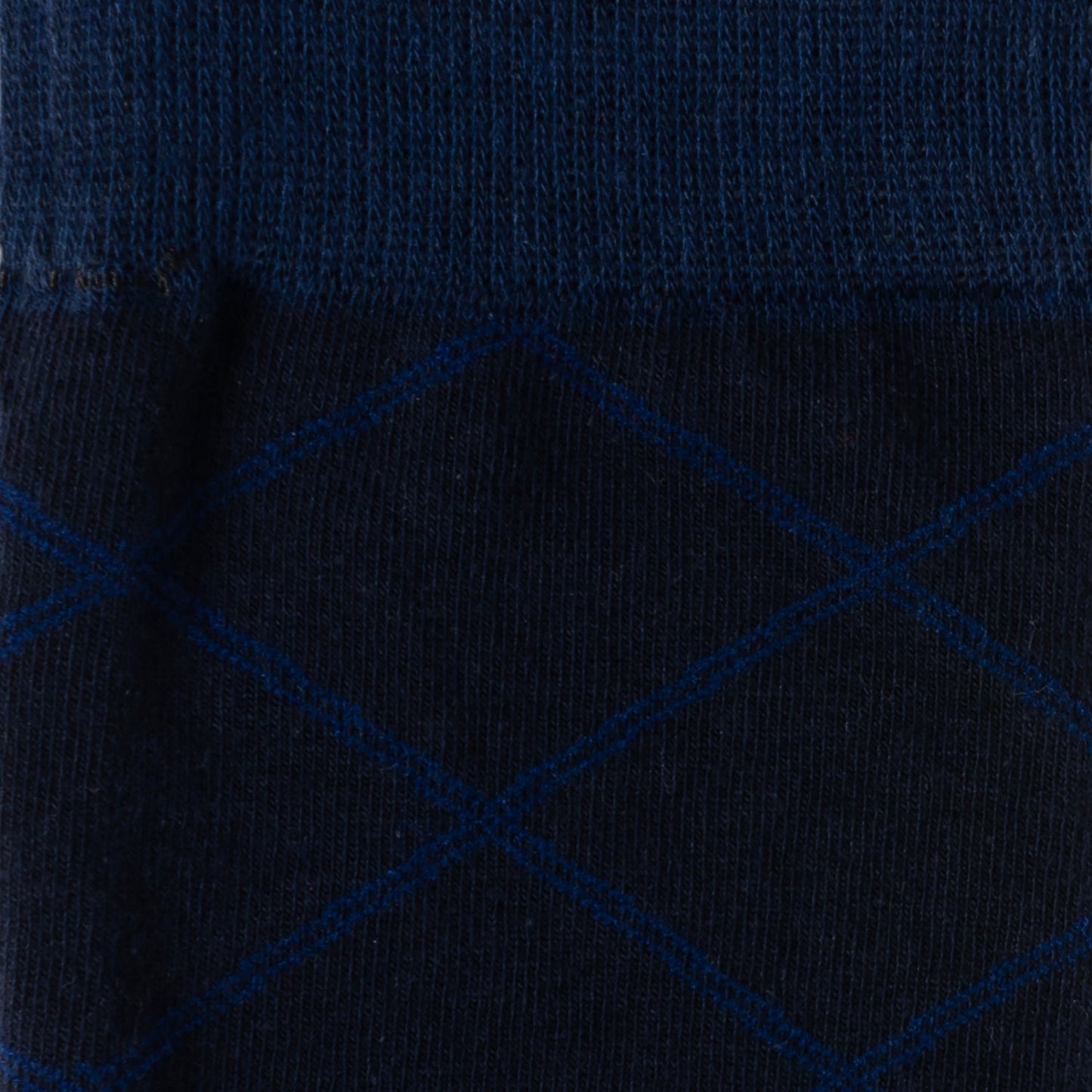 Close-up of a dark blue fabric with a subtle pattern