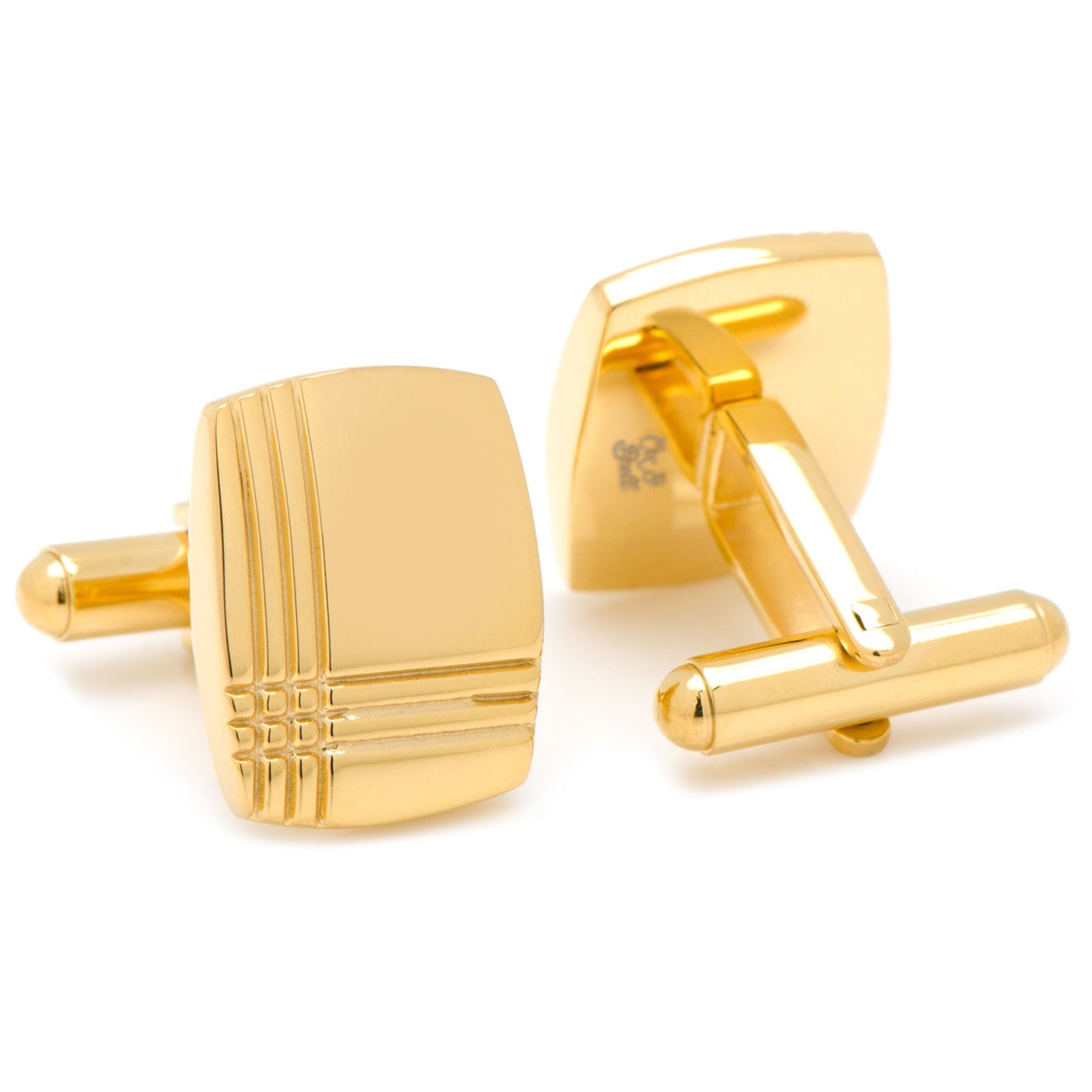 Gold cufflinks on a white background