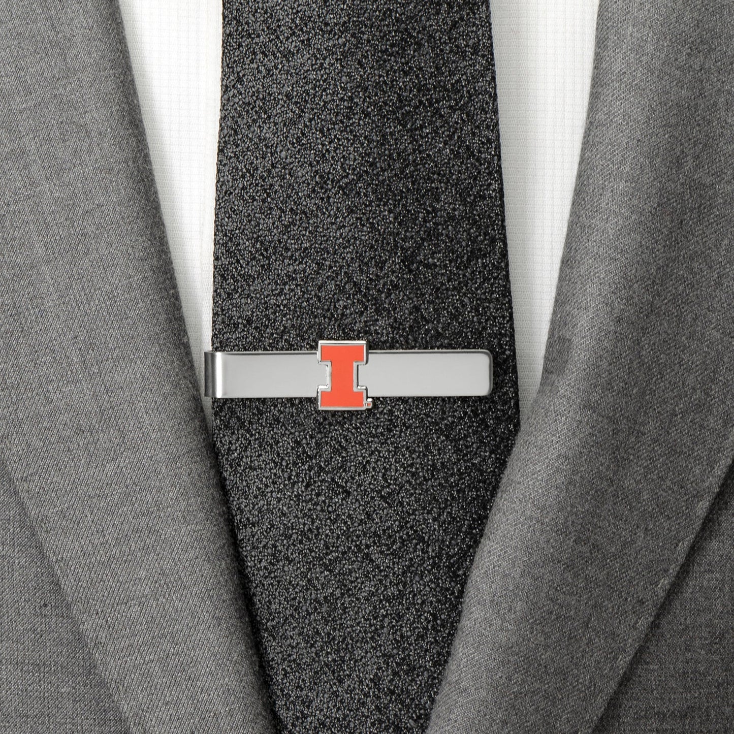 Tie clip with a logo on a gray suit and tie NCAA University of Illinois Cufflinks and Tie Bar Gift Set