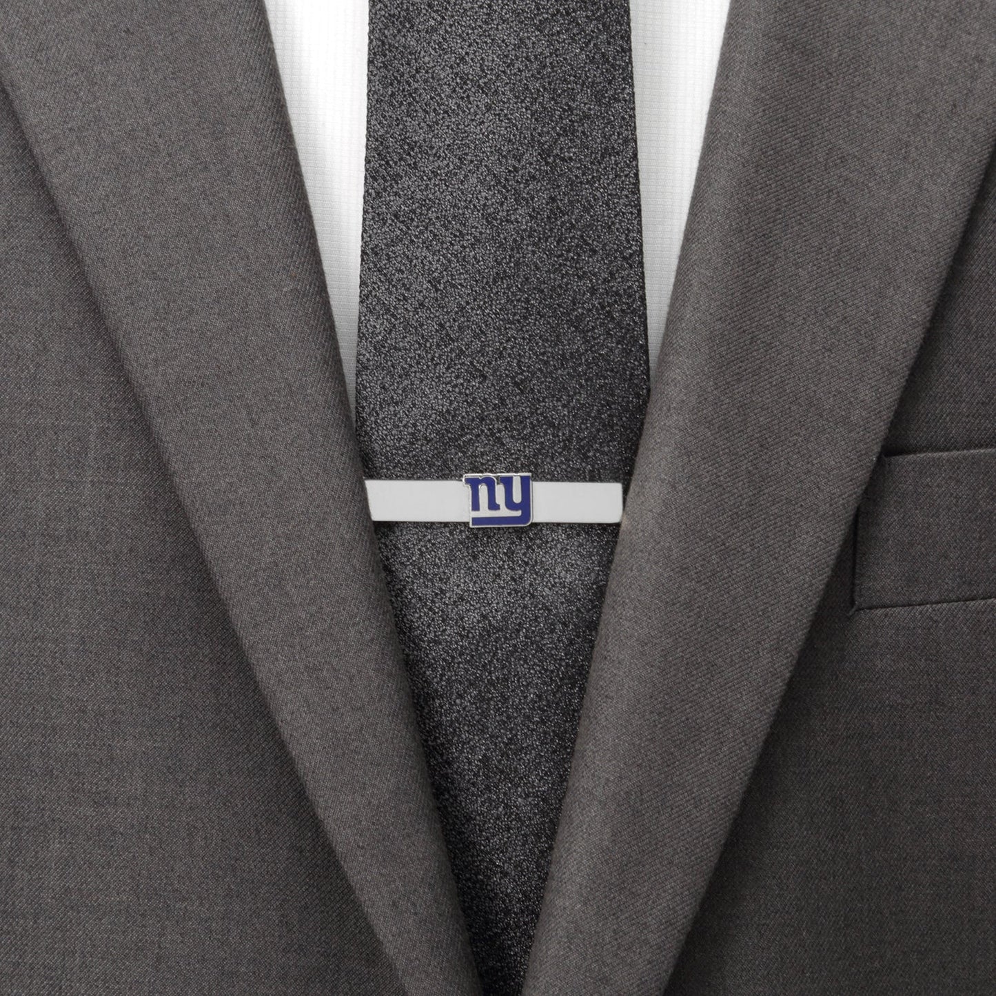 Gray suit jacket with a gray tie and a tie clip on a white background