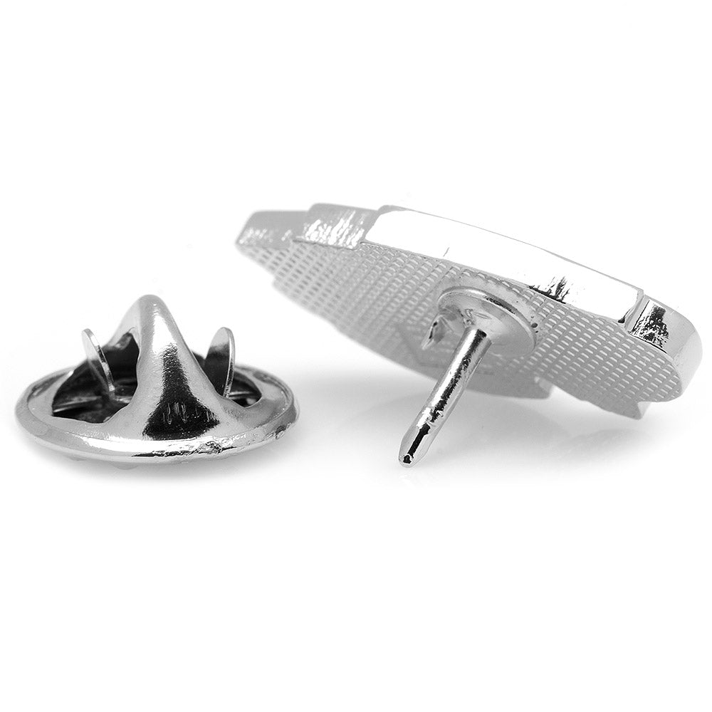 Close-up of two metallic pins on a white background