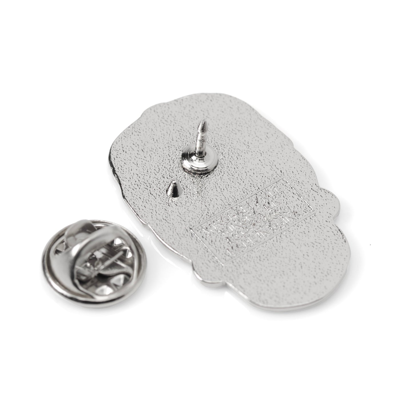 Silver Hamsa hand pin on a white background