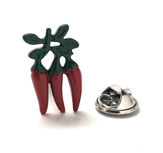 Red chili pepper-shaped lapel pin with green leaves on a white background