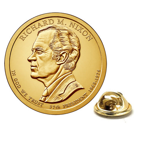 A gold-colored, rhodium-plated lapel pin shaped like a dollar coin, featuring an engraved portrait of Richard Nixon, with a butterfly clasp back.
