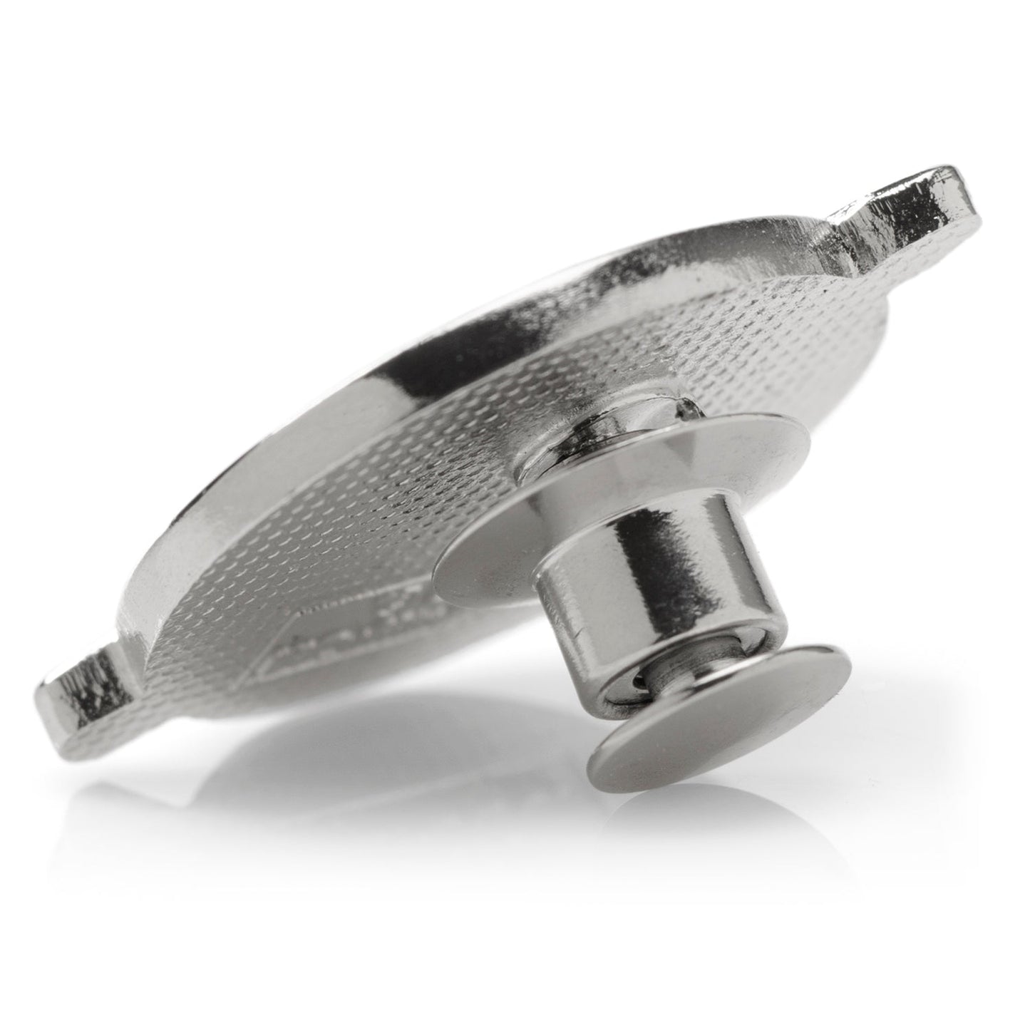Metallic object with textured surface on a white background