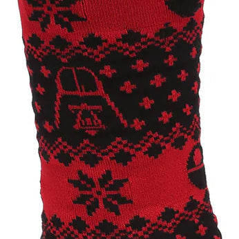 Red and black patterned sock with a design of a bell and star-like shapes.