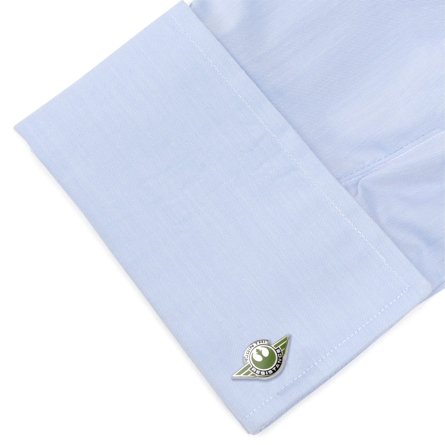 Light blue shirt cuff with a green emblem on a white background Silver Starbird enamel cufflinks close-up