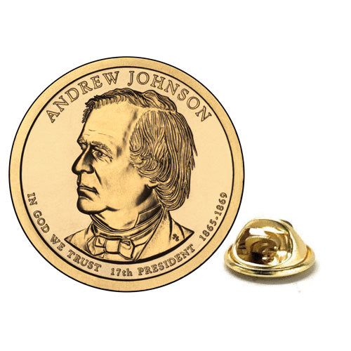 A gold-colored, rhodium-plated lapel pin shaped like a dollar coin, featuring an engraved portrait of Andrew Johnson, with his signature below the image.