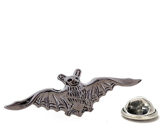 Metallic bat-shaped lapel pin on a white background