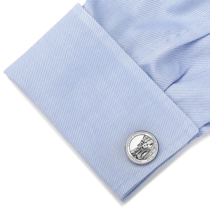 light blue shirt silver-colored cufflinks featuring an engraved design of the Chaco Culture National Historical Park quarter with a year 2012 inscription.