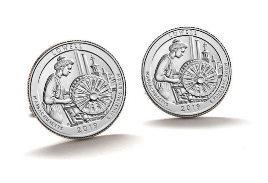 A set of three silver cufflinks featuring an image of a woman on a spinning wheel, indicative of a historical or cultural theme, possibly related to the Lowell National Historical Park.