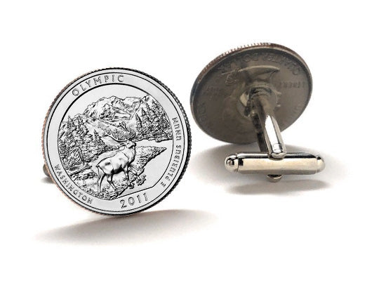 A set of silver coin cufflinks featuring an image of Olympic National Park with a mountain and forest background, based on the 2011 design of the U.S.