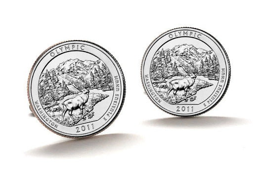 A set of silver coin cufflinks featuring an image of Olympic National Park with a mountain and forest background, based on the 2011 design of the U.S.