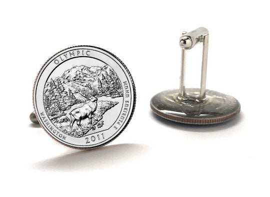 A set of silver coin cufflinks featuring an image of Olympic National Park with a mountain and forest background, based on the 2011 design of the U.S.