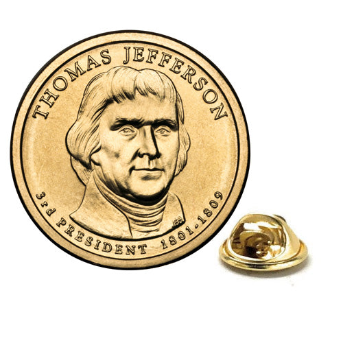 A gold-colored lapel pin shaped like a dollar coin featuring an engraved portrait of Thomas Jefferson, with a butterfly clasp backing.