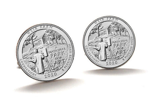 A set of two silver-colored cufflinks featuring national park designs, with the inscription 'Weir Farm National Park' and the year 2020.