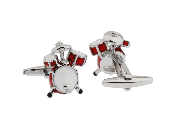 Drum set cufflinks on a white background