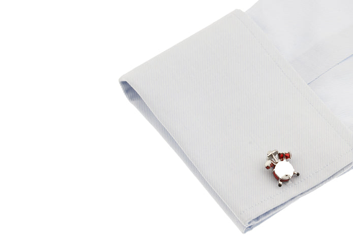 Cufflink on a white shirt with a white background
