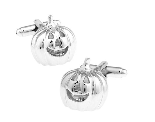 Silver pumpkin-shaped cufflinks on a white background