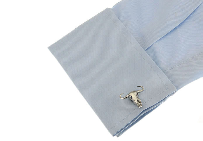 Light blue dress shirt with a cufflink featuring a longhorn bull design on a white background