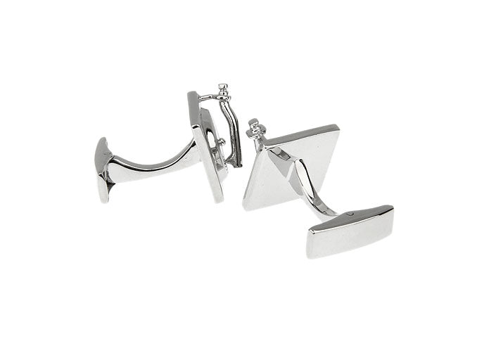 Silver geometric cufflinks on a white background