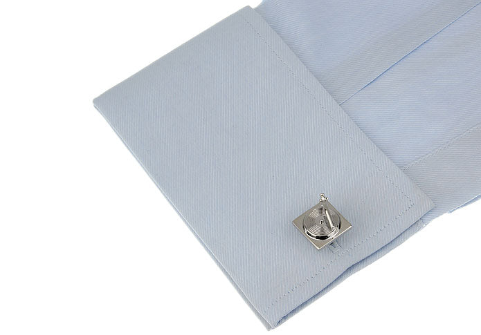 Light blue textured fabric with a silver button on a white background
