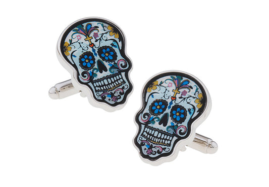 Colorful skull-shaped cufflinks on a white background