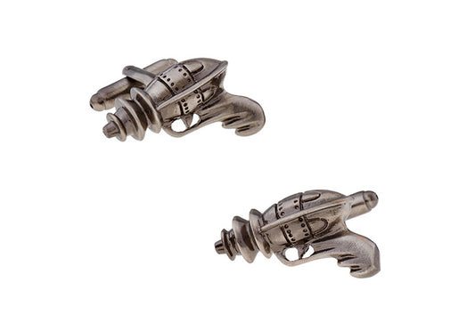 Pair of silver gun-shaped cufflinks on a white background