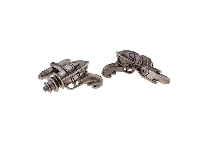 Pair of silver spaceship cufflinks on a white background