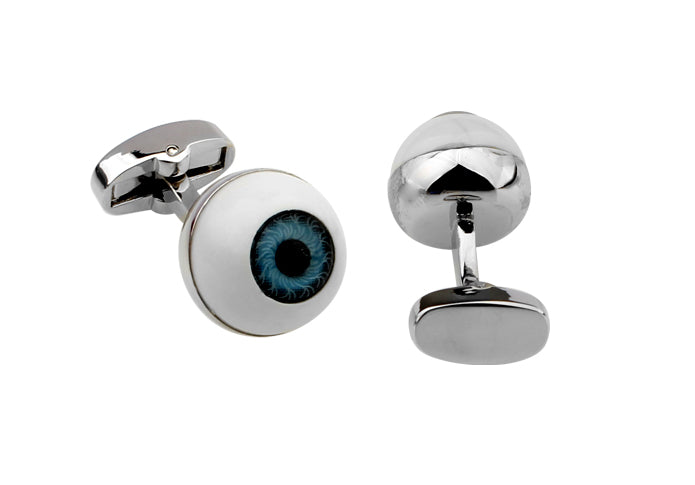 Cufflinks designed like eyeballs on a white background