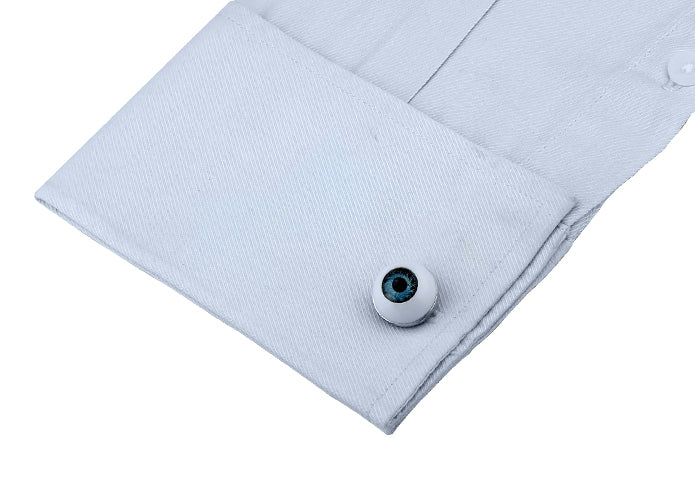 Light blue shirt with a button on a white background