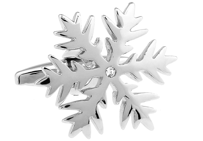 Silver snowflake-shaped earring with a clear gemstone on a white background