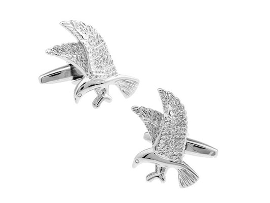 Silver eagle cufflinks on a white background
