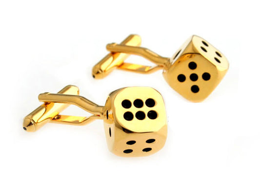 Gold dice-shaped cufflinks on a white background