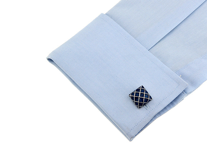 Cufflink on a light blue shirt cuff