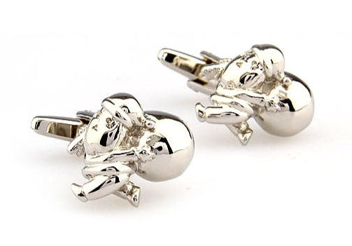 Silver elephant cufflinks on a white background