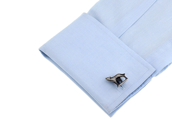 Cufflink on a light blue shirt cuff