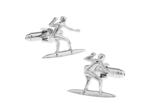 Silver surfboard and surfer cufflinks on a white background