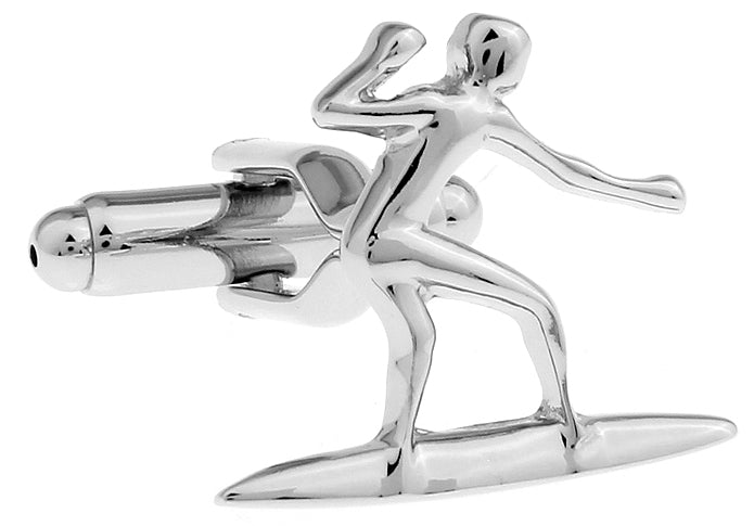 Silver cufflinks shaped like a surfer on a wave on a white background