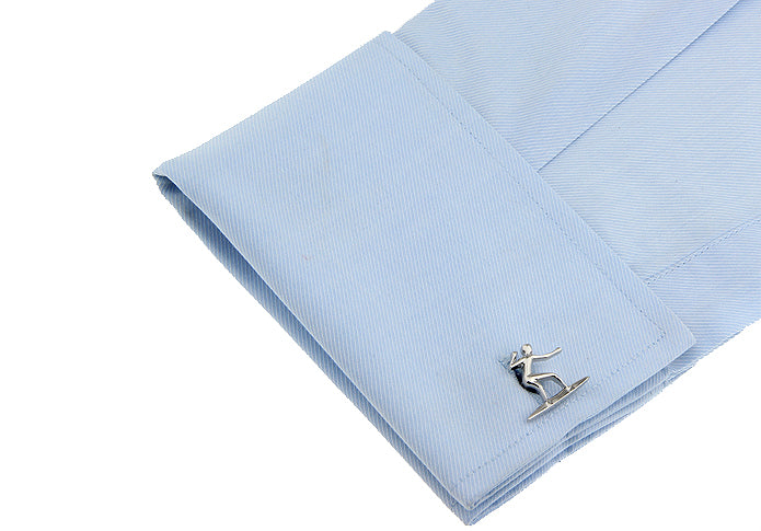 Light blue pocket square with a cufflink featuring a person on a surfboard on a white background