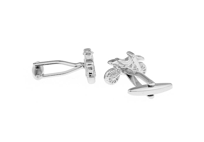 Silver cufflinks on a white background