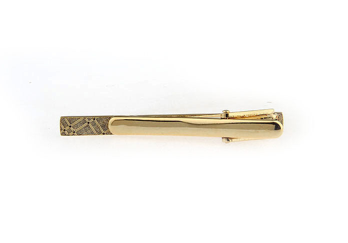 Gold tie clip on a white background