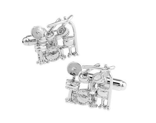 Silver cufflinks with gemstones on a white background