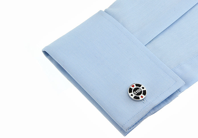 Cufflink on a light blue shirt with a white background