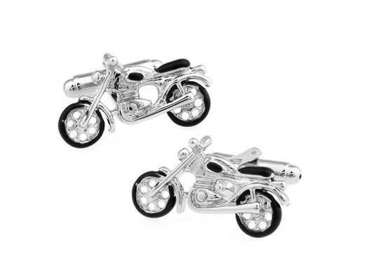 Motorcycle-shaped cufflinks on a white background