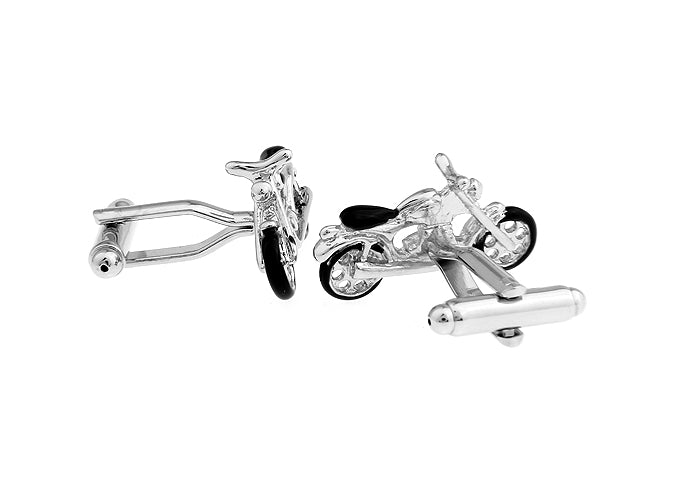 Motorcycle-shaped cufflinks on a white background