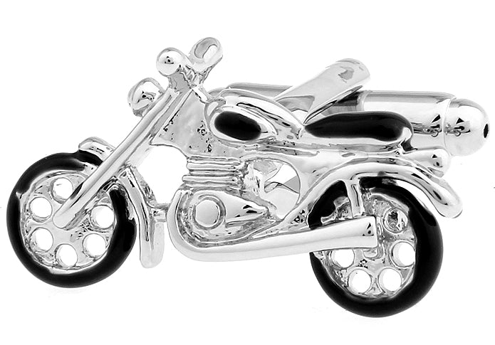 Motorcycle-shaped silver tie clip on a white background