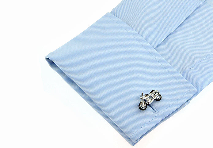 Cufflink on a light blue shirt cuff