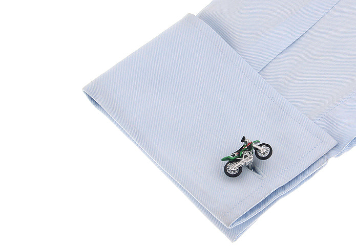 Motorcycle-themed cufflink on a light blue pocket square