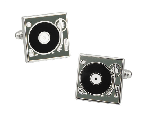 Turntable cufflinks on a white background